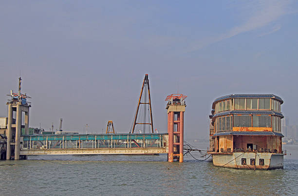 South Amboy, New Jersey - August 14, 2024: A New York Waterway ferry travels the Raritan Bay with the Outerbridge Crossing in the background