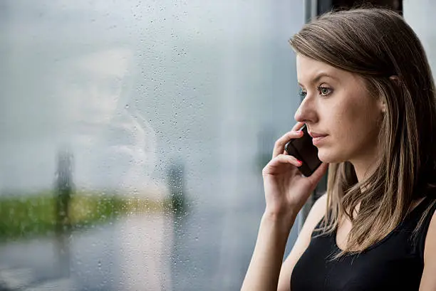 Photo of alone thoughtful sadness women using smartphone at home