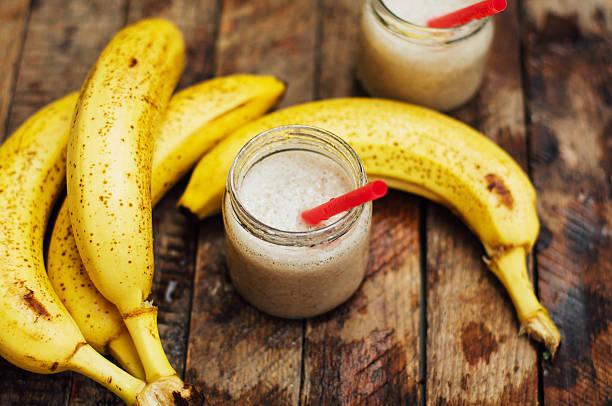 istock Banana Smoothie on a wooden table. Healthy breakfast 542098956