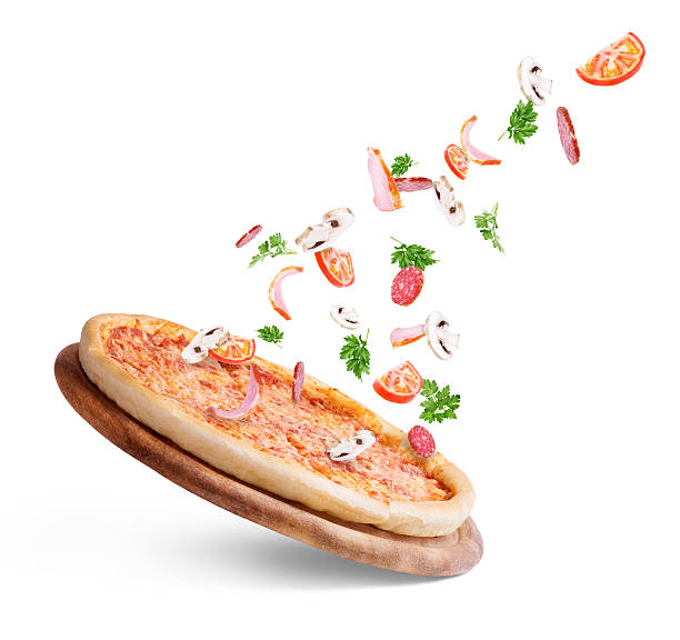 istock Vegetables fly to pizza on a white background 542103098