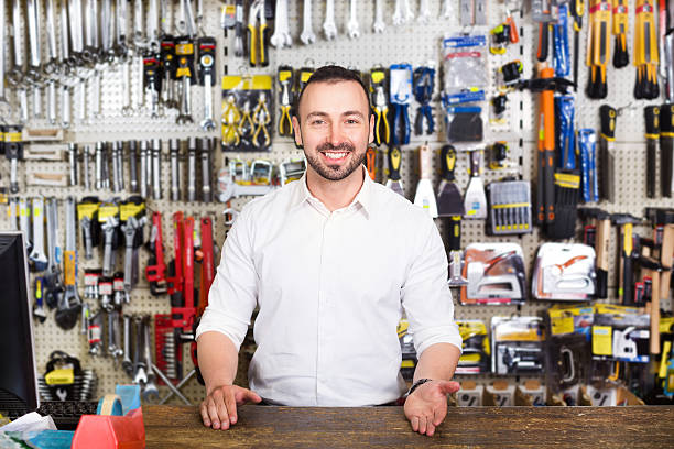 istock Young man cashier at pay desk 542103232