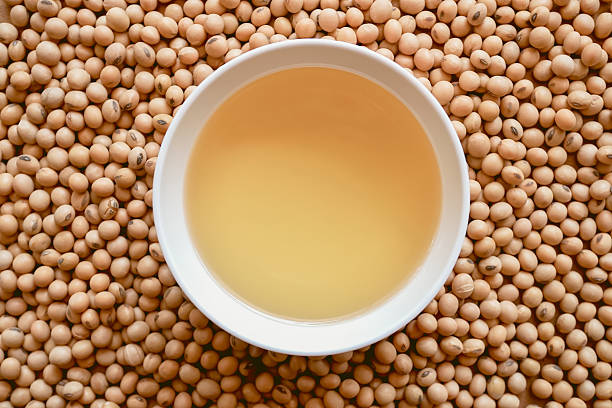 istock oil and soy beans on brown paper 542103670