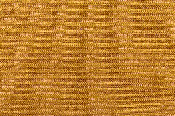 istock Dark orange, ocher background from textile material. Fabric with texture. 542104034