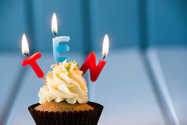 cupcake with a candles for 10 - tenth birthday Birthday's cake - cupcake with a candles for 10 - tenth birthday . Happy birthday ! 10 11 years photos stock pictures, royalty-free photos & images