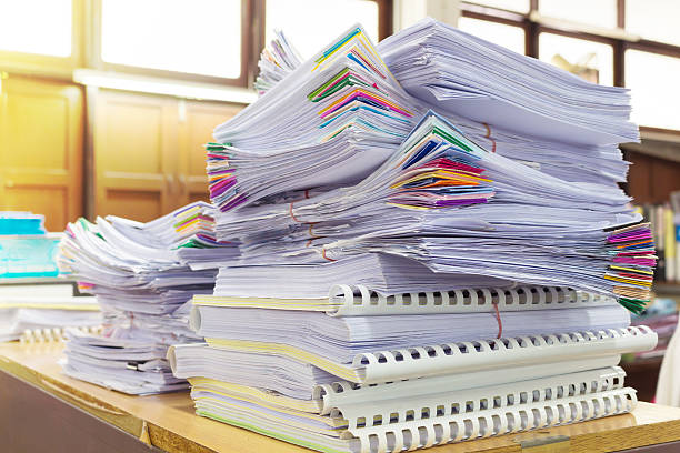 istock Stack of business report paper files with black clips 542107966
