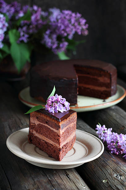 istock piece of chocolate cake decorated with lilac 542111702