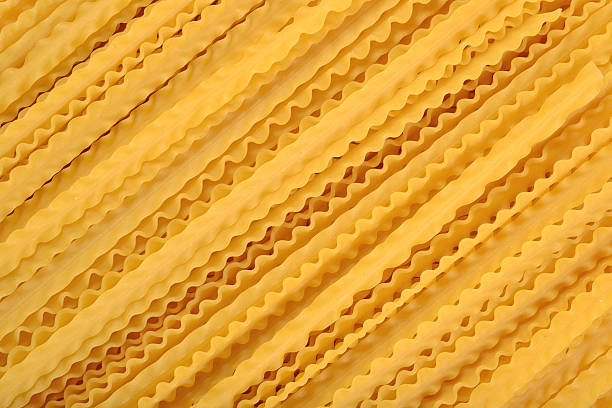 istock Uncooked Italian pasta mafaldine background 542111870