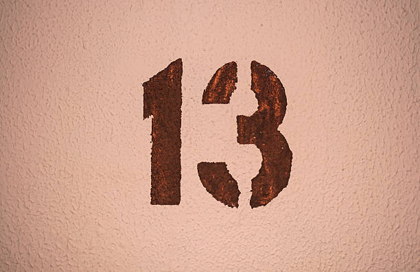 istock The number thirteen painted on the wall 542112178