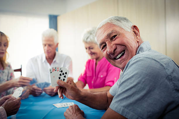 istock Group of seniors playing cards 542173838