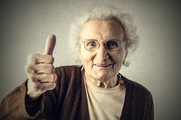 istock Little old woman thumbs up 542176244