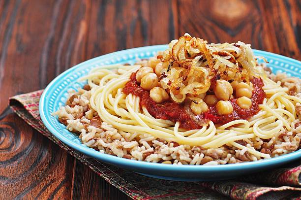 istock Kushari - Egyptian dish of lentils, rice, pasta, chickpeas 542177710