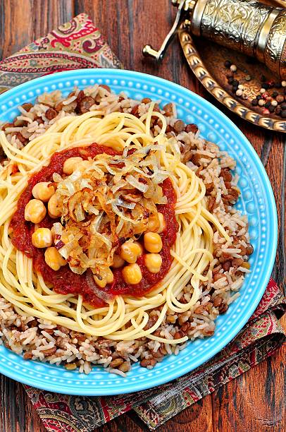 istock Kushari - Egyptian dish of lentils, rice, pasta, chickpeas 542178048