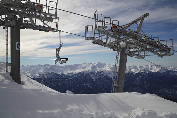 istock Chair lift against panoramic view of mountain range 542180250