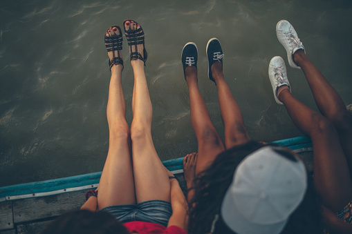 Friends sitting on the dock