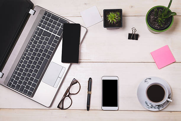 istock Modern office desk with laptop, phone and coffee 542190920