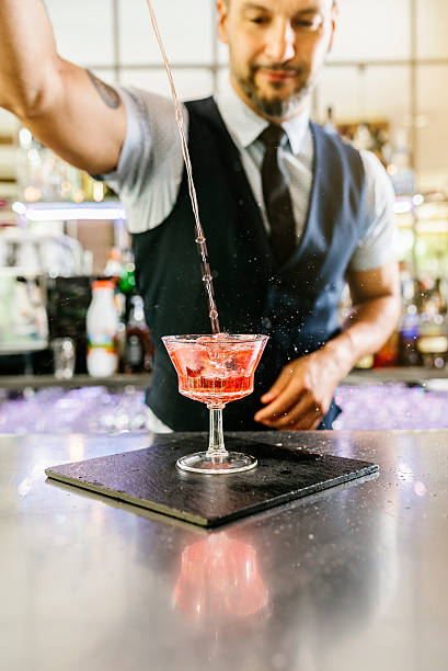 istock Barman is making cocktail at night club. 542192244