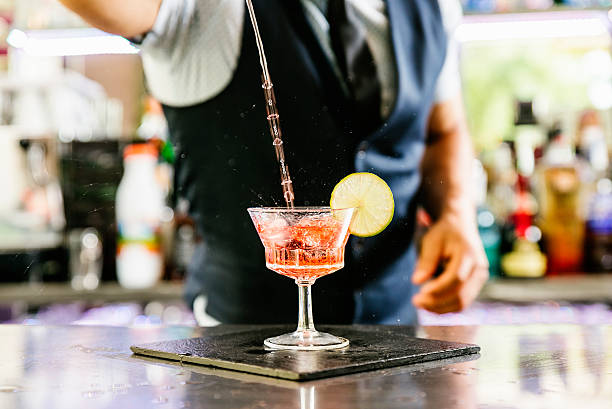 istock Barman is making cocktail at night club. 542192306