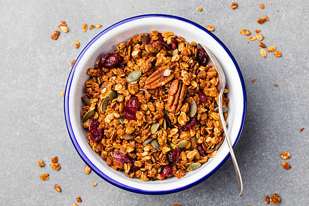 istock Fresh granola, muesli with pumpkin, pecan nuts, cranberries, maple syrup 542194966