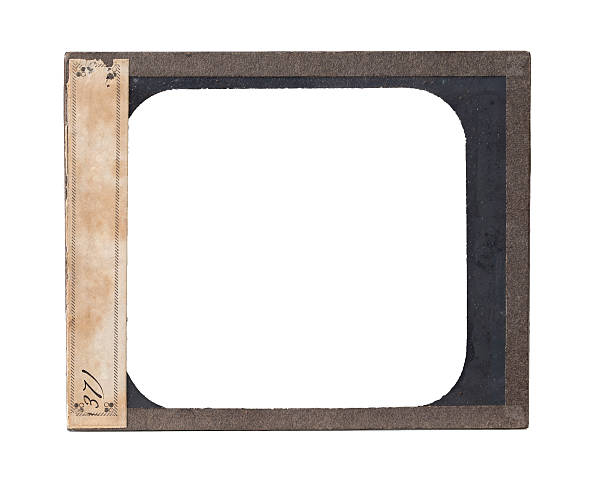 Antique Glass Plate Negative Metal Frame A antique glass plate negative with paper label and clipping path.  Please see my portfolio for other film backgrounds and textures.   film negative photos stock pictures, royalty-free photos & images
