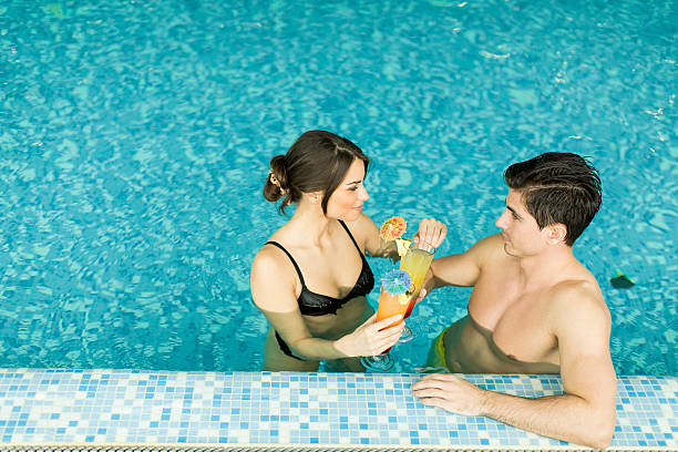istock Couple by the pool 542195750