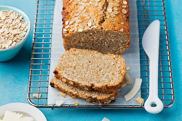 istock Healthy vegan oat, coconut loaf bread, cake on cooling rack 542197056