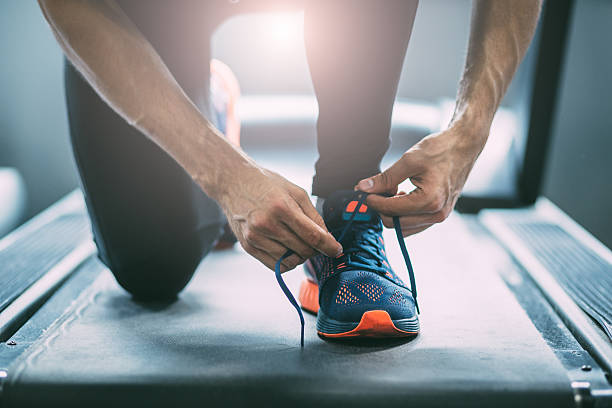 istock Portrait of a man tying shoelaces 542197406