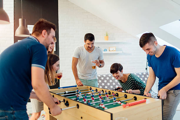 istock Young People Playing Foosball. 542197586