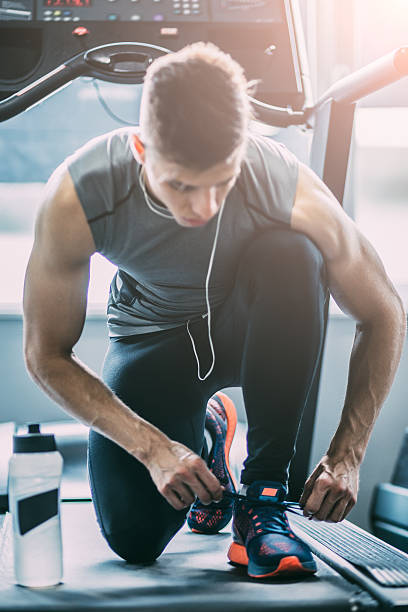 istock Portrait of a man tying shoelaces 542198196