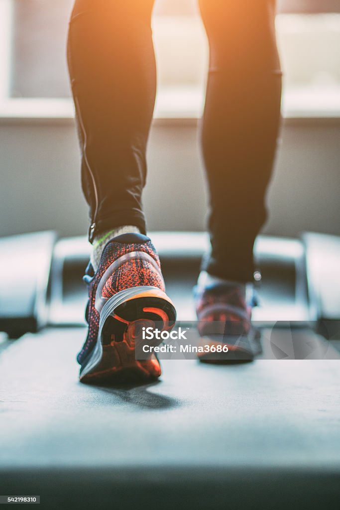 Running Man running in a gym on a treadmill Treadmill Stock Photo