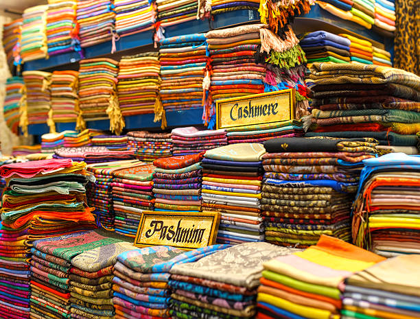 istock Vibrant stacks and rolls of turkish fabric. 542198436