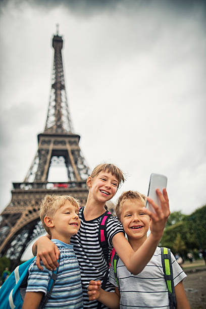 istock Kids tourists taking selfie near Eiffel Tower 542198610