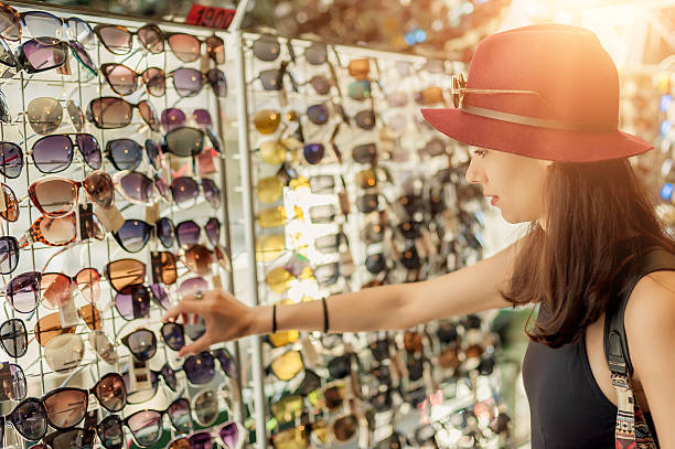istock Woman buying sunglasses 542199308