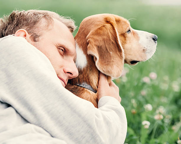 istock Man hugs his favorite dog 542199602