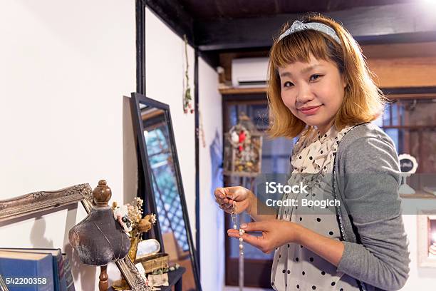 Japanese Woman Working In Her Own Business Selling Jewelry Stock Photo - Download Image Now