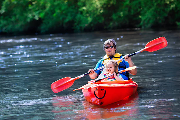 istock Father and child kayaking in summer 542200480