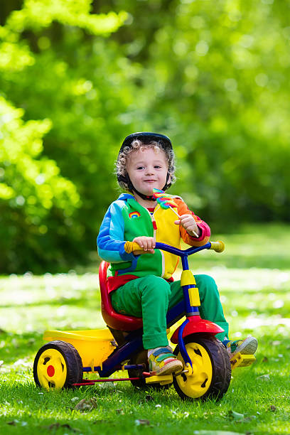 istock Little boy on colorful tricycle 542202624