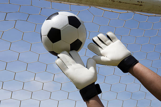 istock goalkeeper reaching for the foot ball 542202736