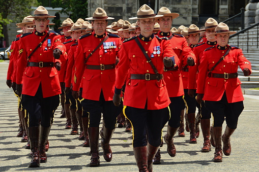 Victoria BC,Canada.June 10th 2014.Uniformed Canadian RCMP Police march in unison in honor of fallen officers who have given the ultimate sacrifice while doing their duty.