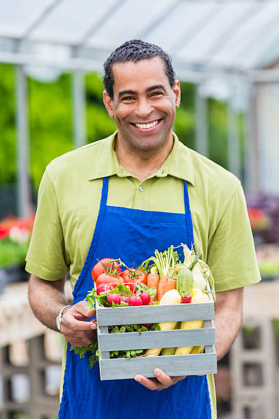 istock Smiling farmer with fresh produce 542203826