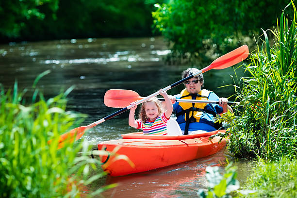 istock Father and child kayaking in summer 542205970