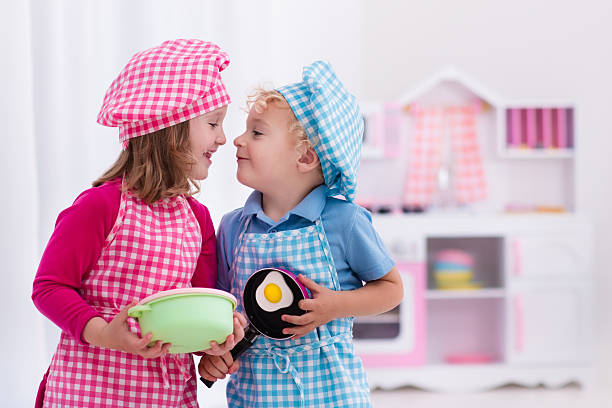 istock Sweet kids playing with toy kitchen 542206064