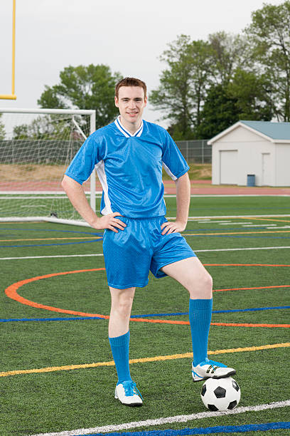 istock A man is standing in his soccer uniform, shin gaurds 542206858