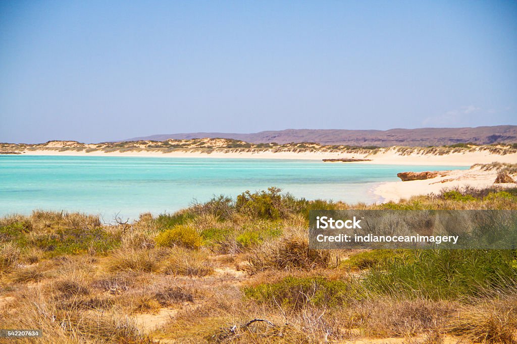 Sandy Bay, Exmouth, Western Australia The shallow waters and wide expanse of endless white sand make this a great choice for families. Exmouth - Western Australia Stock Photo