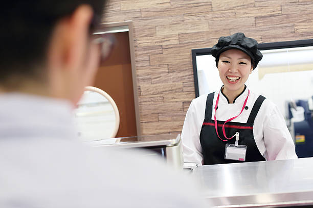 istock Female butcher in a supermarket 542207974