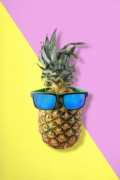 istock Pineapple with sunglasses for tropical summer idea 542208860