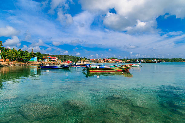 view of corn island Nicaragua. sea with boats, blue sky stock photo