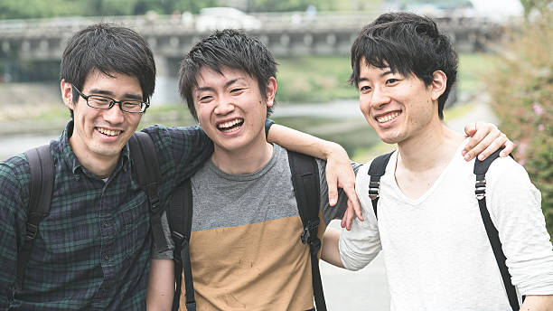 istock Three students holding their shoulders with arms together 542211854