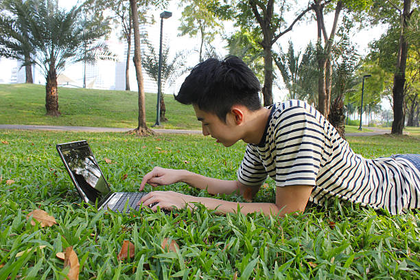 istock Young man working in the park 542211998