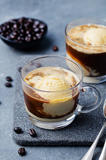 istock Affogato coffee with ice cream on glass cup Grey background 542212254