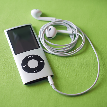 Berry, Australia - June 23, 2016: An Apple iPod Nano 4th generation, in silver,  with Apple Earpods attached.
